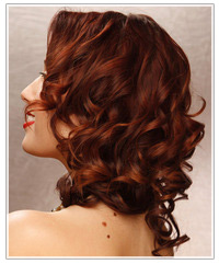 Model with dark curly red hair