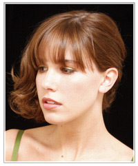 Model with curly mid-length hairstyle