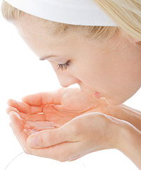 Woman washing face