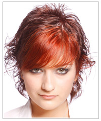 Woman with short wavy brown and red hair