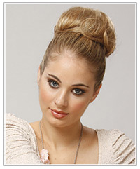 Model with blonde top knot updo