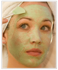 Model applying a face mask