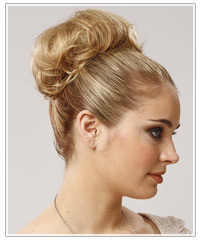 Model with a top knot bun