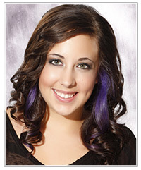 Model with brunette hair and purple highlights