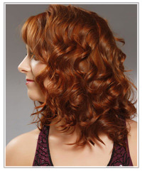 Model with glossy red curls